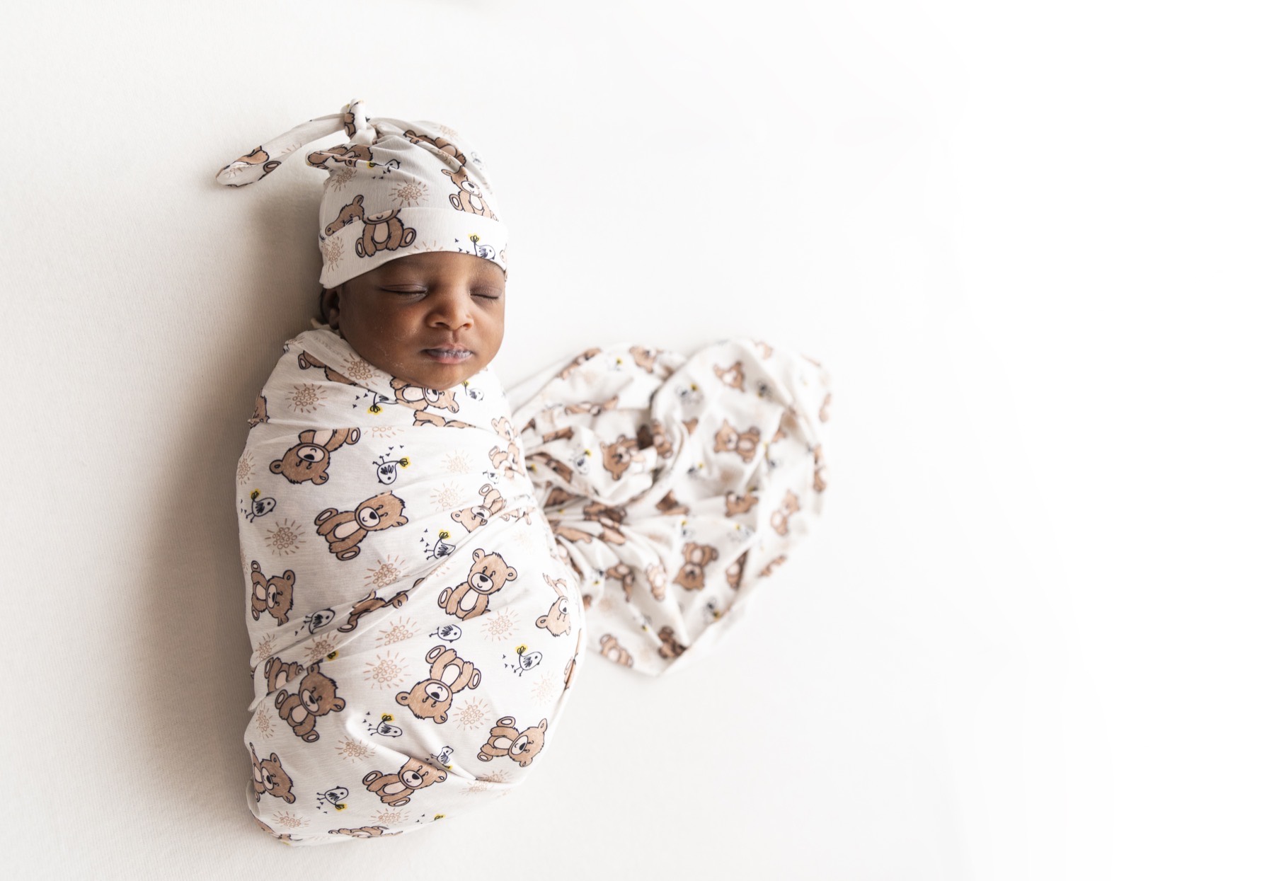 Newborn in swaddle during rest