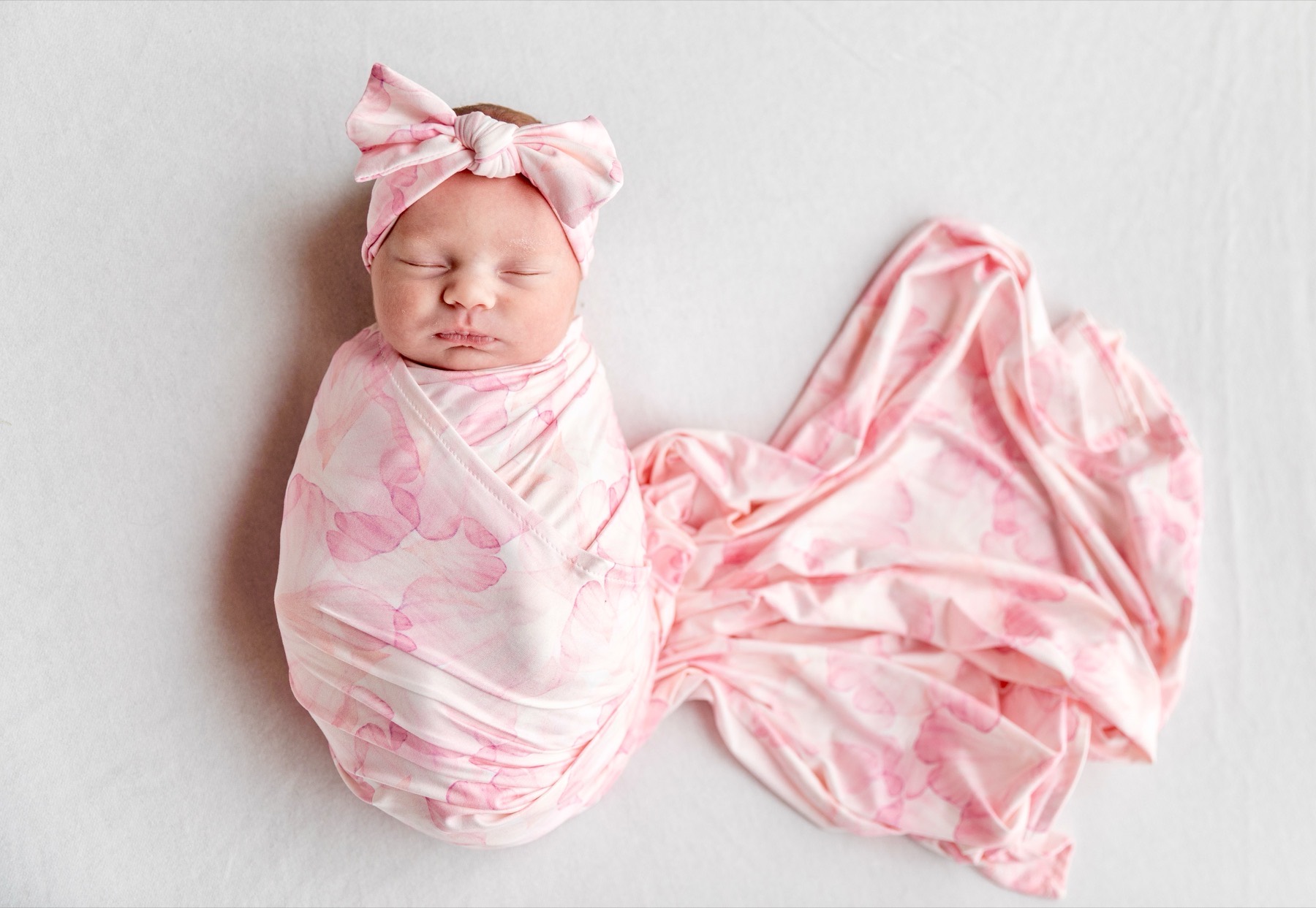 Baby in Rose Petal swaddle